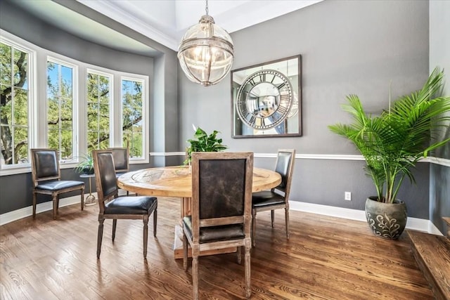 dining room with a notable chandelier and hardwood / wood-style flooring