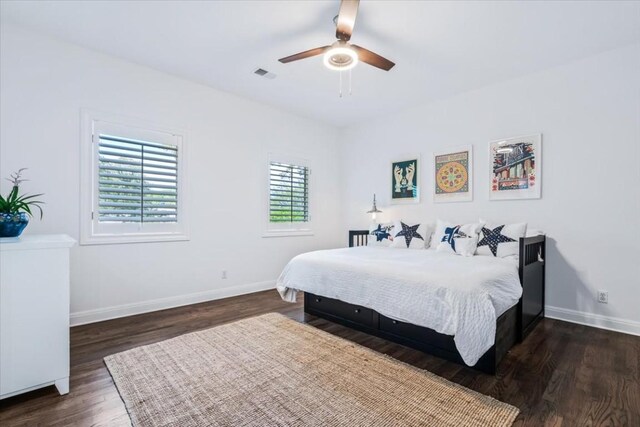 bedroom featuring ceiling fan and dark hardwood / wood-style floors