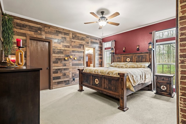 bedroom featuring light carpet, crown molding, and ceiling fan