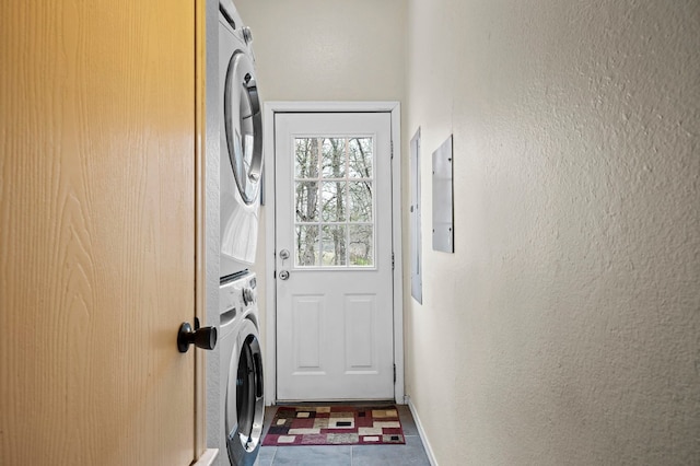 entryway with stacked washer / drying machine