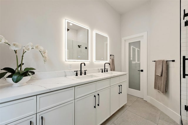 bathroom featuring vanity, tile patterned floors, and walk in shower