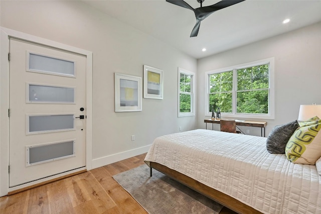 bedroom with ceiling fan and light hardwood / wood-style flooring