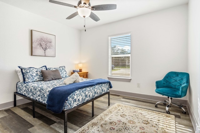 bedroom with wood-type flooring and ceiling fan