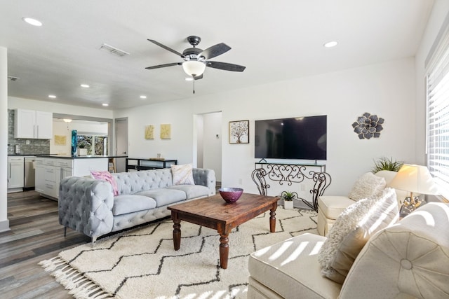 living room featuring hardwood / wood-style flooring and ceiling fan