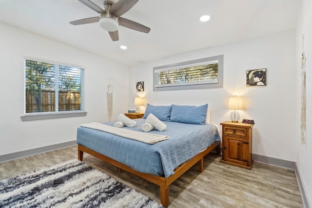 bedroom featuring hardwood / wood-style flooring and ceiling fan