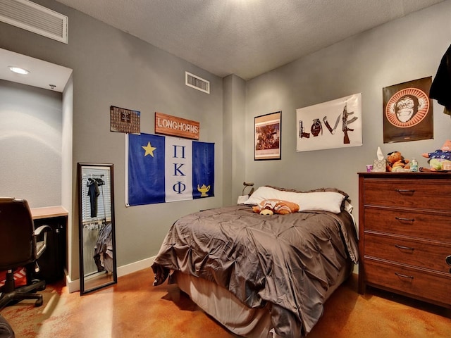 bedroom featuring a textured ceiling