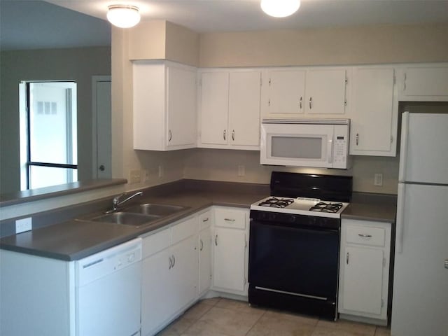 kitchen featuring white cabinetry, white appliances, light tile patterned flooring, and sink