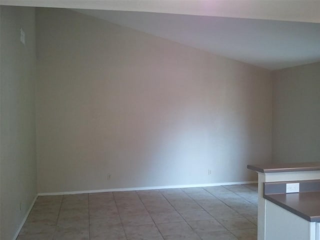 empty room with light tile patterned flooring