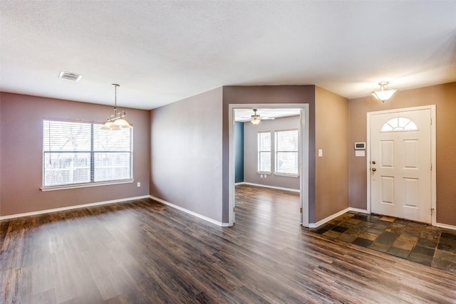 entryway with dark wood-type flooring