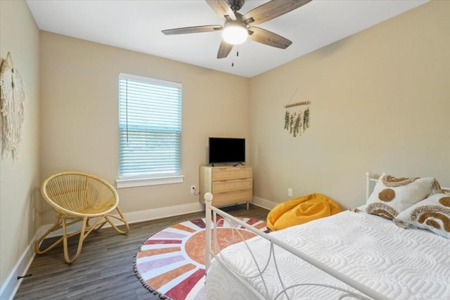 bedroom with dark wood-type flooring and ceiling fan