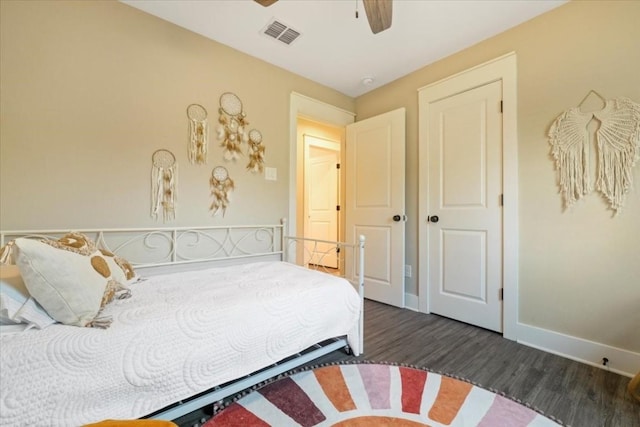 bedroom featuring dark hardwood / wood-style floors and ceiling fan