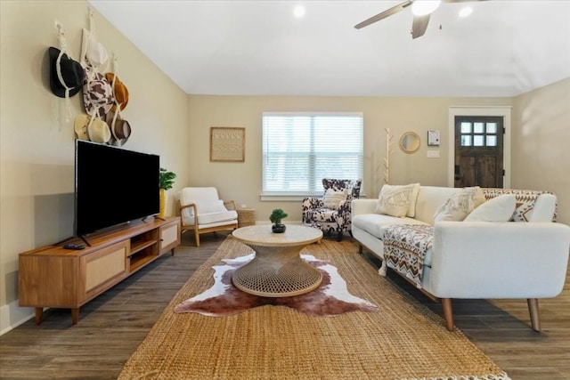 living room with ceiling fan and dark hardwood / wood-style floors