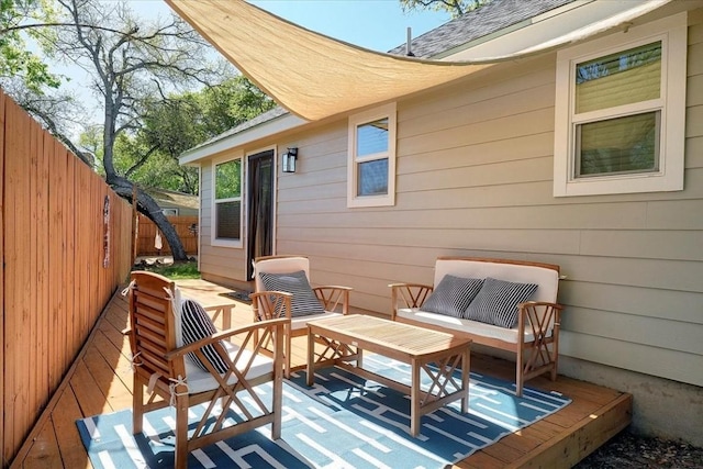 wooden terrace featuring an outdoor living space