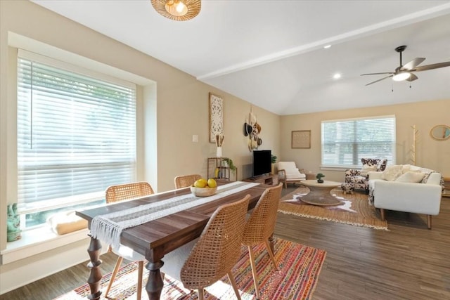 dining area with lofted ceiling, dark hardwood / wood-style floors, and ceiling fan