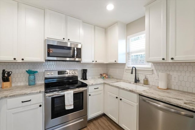 kitchen featuring white cabinetry, sink, and stainless steel appliances