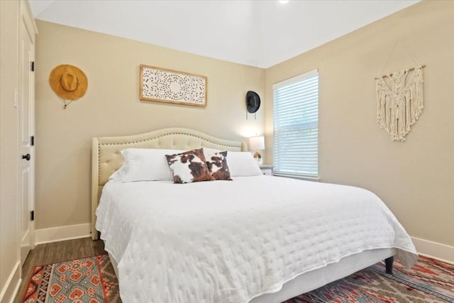 bedroom featuring dark hardwood / wood-style flooring