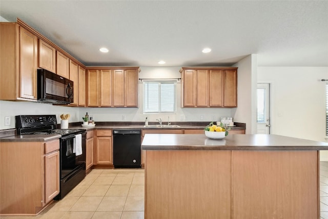 kitchen with a kitchen island, sink, light tile patterned floors, and black appliances