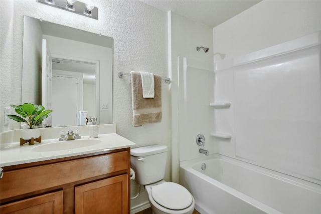 full bathroom with vanity, toilet, and  shower combination