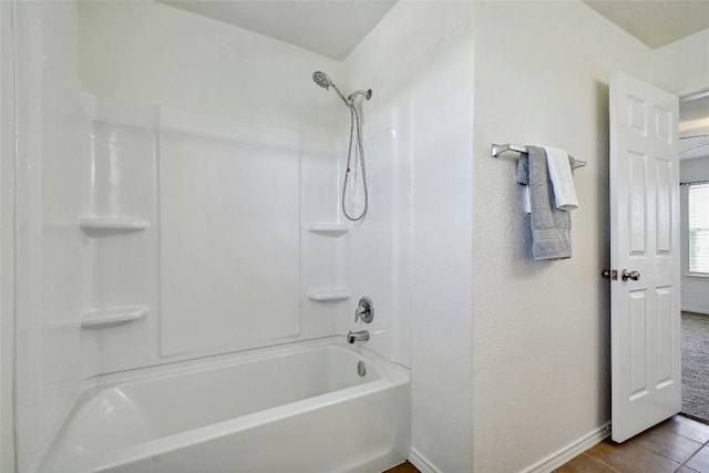 bathroom with tile patterned floors and tub / shower combination