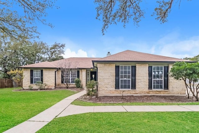 ranch-style house with a shingled roof, stone siding, a chimney, fence, and a front yard