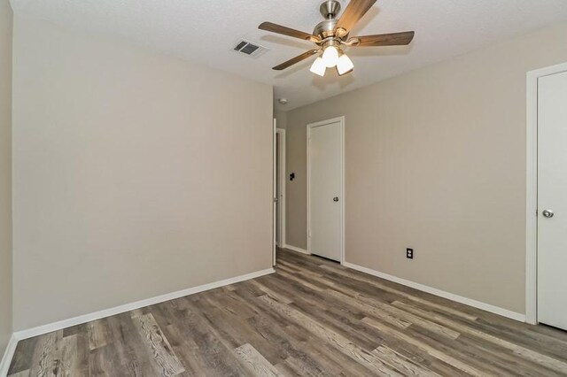 6333 La Mesa St, Leander, TX 78645 - unfurnished room featuring wood finished floors and a ceiling fan