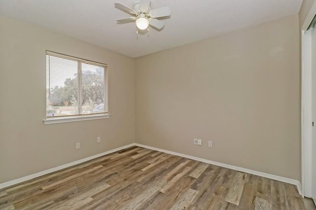 6333 La Mesa St, Leander, TX 78645 - spare room featuring wood finished floors and a ceiling fan