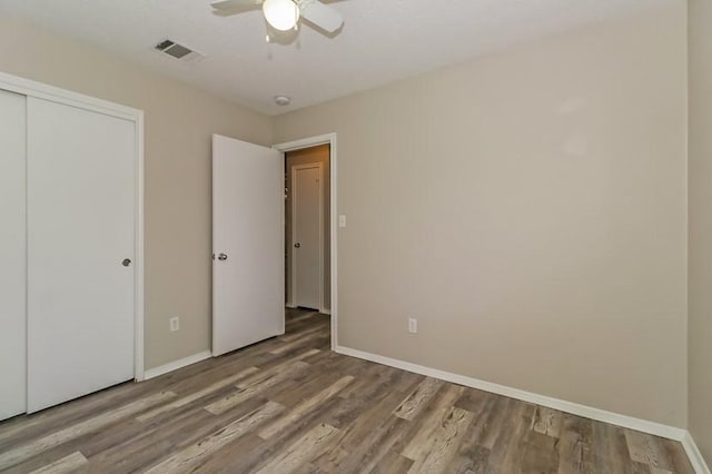 6333 La Mesa St, Leander, TX 78645 - unfurnished bedroom featuring wood finished floors, a closet, and ceiling fan