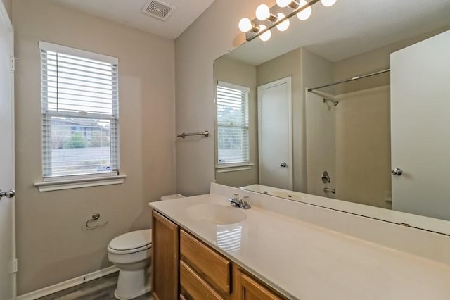 6333 La Mesa St, Leander, TX 78645 - bathroom with plenty of natural light, vanity, a shower, and wood finished floors