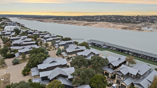 aerial view at dusk with a water view