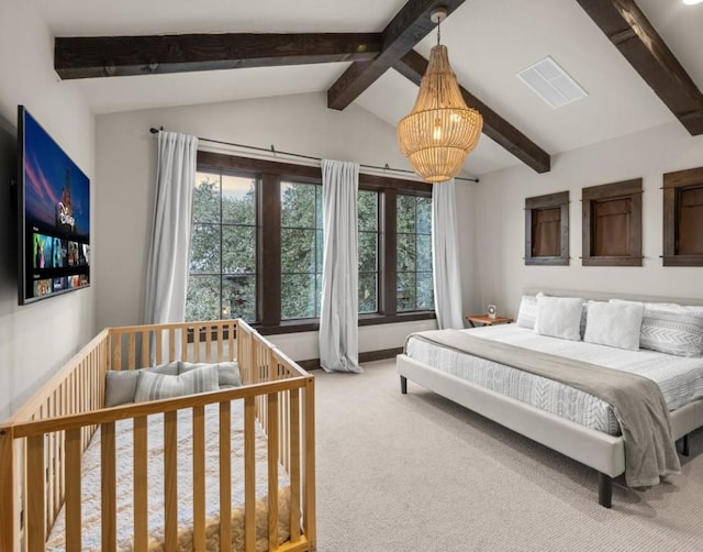 bedroom with an inviting chandelier, lofted ceiling with beams, and carpet