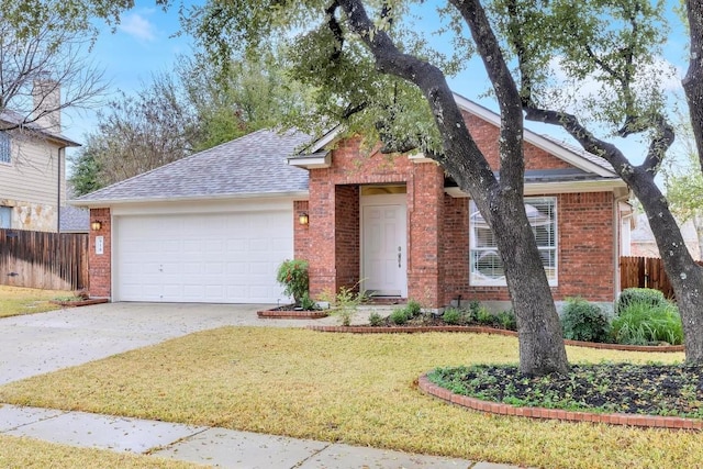 view of front of property featuring a garage and a front yard