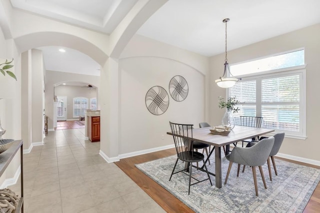 616 Basie Bnd, Cedar Park, TX 78613 - dining space with arched walkways, plenty of natural light, and light wood-style flooring
