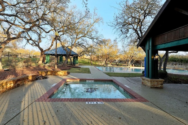 view of pool with a gazebo and a patio