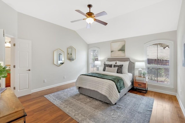 bedroom with lofted ceiling, wood-type flooring, and ceiling fan