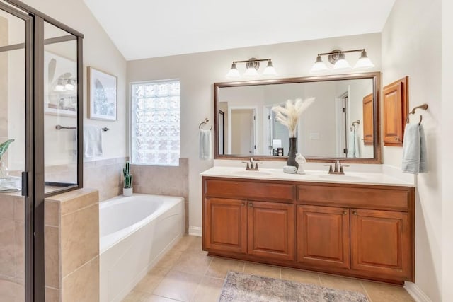 bathroom featuring lofted ceiling, vanity, tile patterned flooring, and separate shower and tub