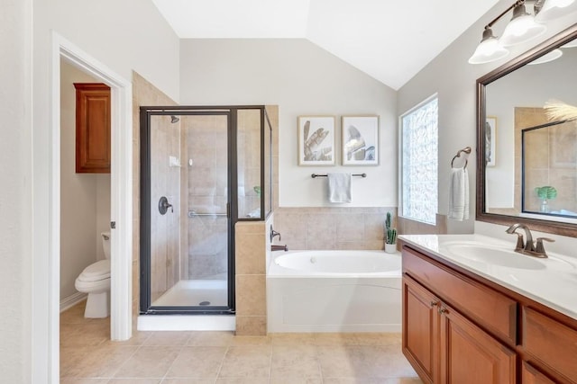 full bathroom featuring vaulted ceiling, separate shower and tub, vanity, and toilet