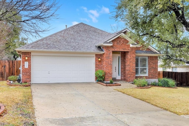 view of front of home featuring a garage and a front lawn