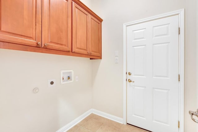 laundry room with cabinets, hookup for an electric dryer, hookup for a washing machine, and light tile patterned floors