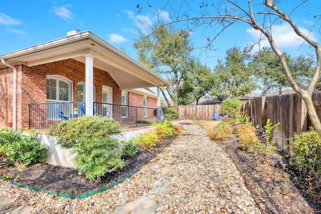 view of yard with covered porch