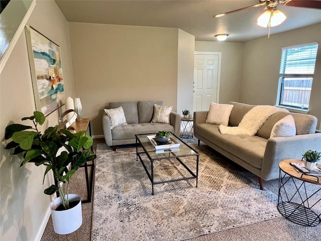 living room with carpet floors and ceiling fan