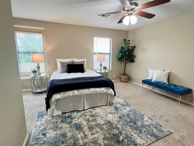 carpeted bedroom with ceiling fan