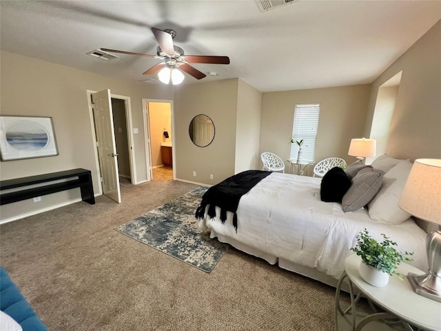 carpeted bedroom with connected bathroom and ceiling fan