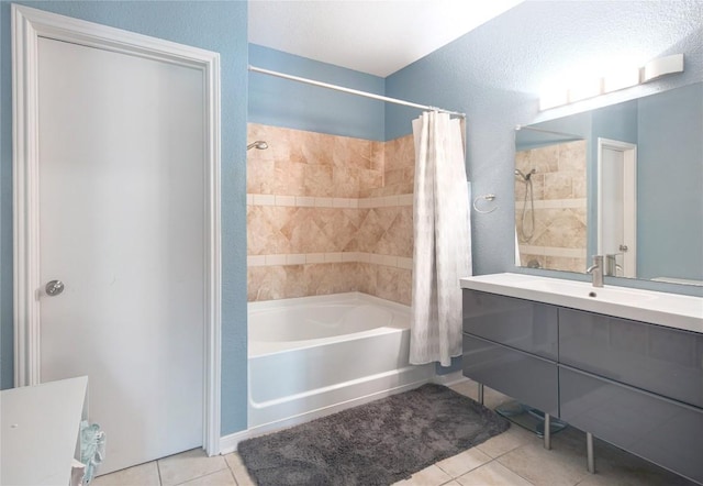 bathroom with shower / tub combo, vanity, and tile patterned flooring