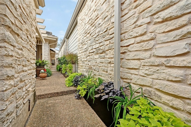 view of side of property featuring a patio