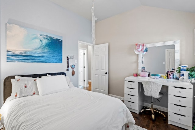 bedroom with lofted ceiling and dark wood-type flooring