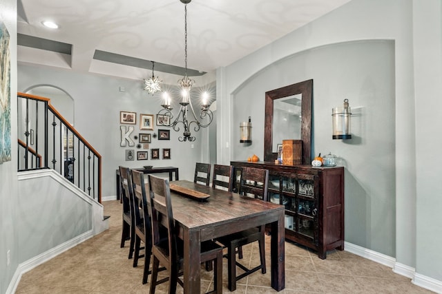 dining area featuring an inviting chandelier and light tile patterned floors