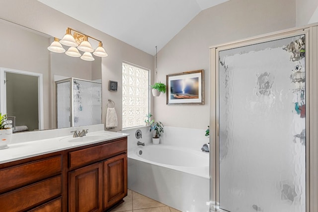 bathroom featuring lofted ceiling, vanity, tile patterned floors, and separate shower and tub