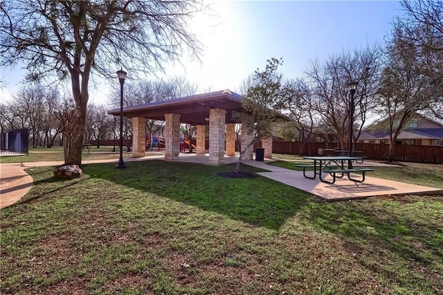 surrounding community featuring a lawn and a patio