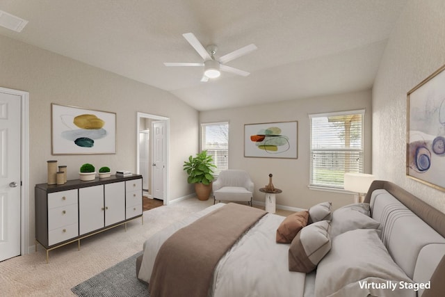 bedroom with visible vents, vaulted ceiling, carpet flooring, and multiple windows