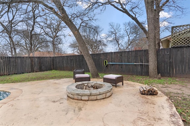 view of patio / terrace featuring a fire pit